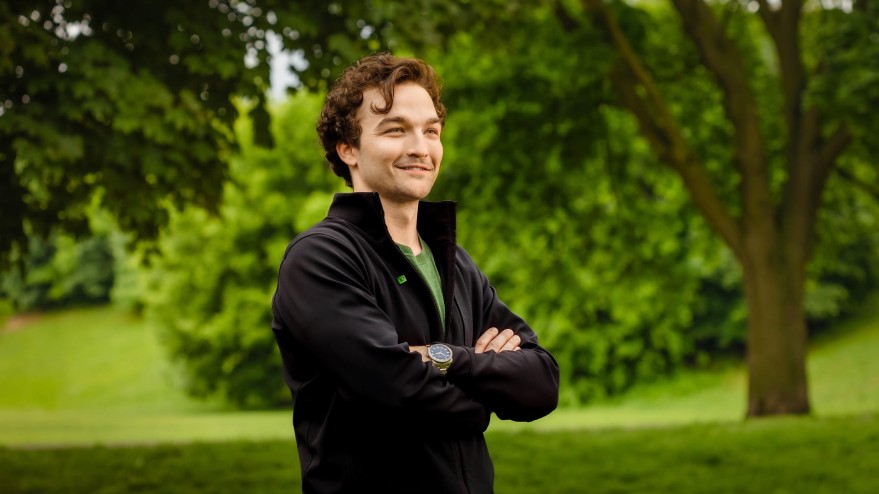 a young, male, TD employee with dark hair