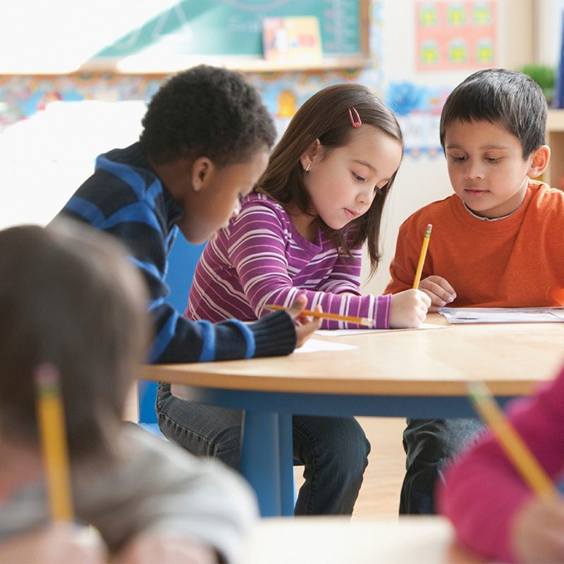 Children working at a school desk