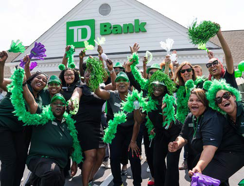 TD employees cheering in front of a TD branch in Charlotte, North Carolina