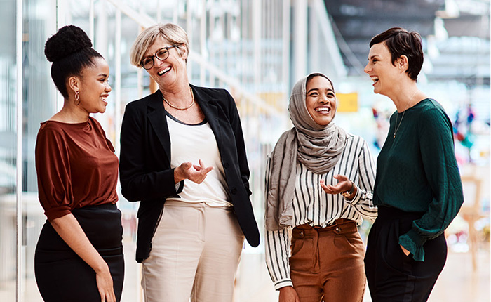 Group of women laughing in office space