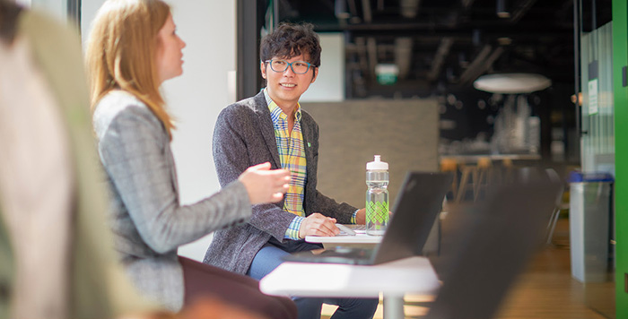 Two young people sitting in coffee shop