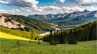 Scenic view of mountains and green valleys