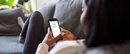 A lady on her mobile filling out the TD form for non-fraud transaction disputes