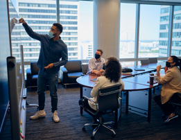 Business team in a meeting wearing protective face masks