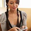 TD female aboriginal employee responds to a TD mentor on her phone.